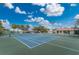 Well-maintained tennis courts with ample space for players at 10214 Windsong Rd, Punta Gorda, FL 33955
