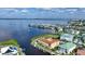 Aerial view of waterfront property with boat slips and nearby marina at 115 Breakers Ct # 111, Punta Gorda, FL 33950