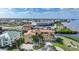 Aerial view of waterfront condo community with lush landscaping and private boat docks at 115 Breakers Ct # 111, Punta Gorda, FL 33950
