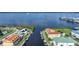 Aerial view showcasing waterfront home and boat at 115 Breakers Ct # 111, Punta Gorda, FL 33950