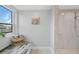 Small bathroom with walk in shower and window at 115 Breakers Ct # 111, Punta Gorda, FL 33950