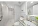 Spa-like bathroom with walk-in shower and granite vanity at 115 Breakers Ct # 111, Punta Gorda, FL 33950