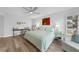 Bright bedroom with king-size bed and workspace at 115 Breakers Ct # 111, Punta Gorda, FL 33950