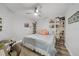 Bedroom with king bed, built-in shelving, and hardwood floors at 115 Breakers Ct # 111, Punta Gorda, FL 33950