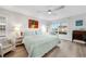 Spacious bedroom with king-size bed and water view at 115 Breakers Ct # 111, Punta Gorda, FL 33950