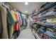 Walk-in closet with ample shelving and hanging space at 115 Breakers Ct # 111, Punta Gorda, FL 33950