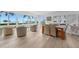 Casual dining area with water views and wood table at 115 Breakers Ct # 111, Punta Gorda, FL 33950