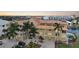 Waterfront building, featuring a copper roof and palm trees at 115 Breakers Ct # 111, Punta Gorda, FL 33950