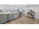 Modern kitchen with gray cabinets and stainless steel appliances at 115 Breakers Ct # 111, Punta Gorda, FL 33950