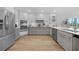 Modern kitchen with gray cabinets and white countertops at 115 Breakers Ct # 111, Punta Gorda, FL 33950