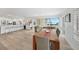Bright kitchen with white cabinets, island, and stainless steel appliances at 115 Breakers Ct # 111, Punta Gorda, FL 33950