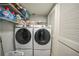 Laundry room with side-by-side washer and dryer, and shelving at 115 Breakers Ct # 111, Punta Gorda, FL 33950