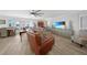 Relaxing living room with hardwood floors and comfortable seating at 115 Breakers Ct # 111, Punta Gorda, FL 33950