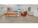 Living room with hardwood floors, comfy seating and large TV at 115 Breakers Ct # 111, Punta Gorda, FL 33950