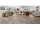 Spacious living room with hardwood floors and ample seating at 115 Breakers Ct # 111, Punta Gorda, FL 33950