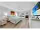 Main bedroom with king-size bed and water views at 115 Breakers Ct # 111, Punta Gorda, FL 33950