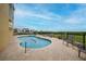 Inviting pool and spa area with lounge chairs, offering a relaxing waterfront view at 115 Breakers Ct # 111, Punta Gorda, FL 33950