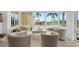Sunroom with water views and comfortable seating at 115 Breakers Ct # 111, Punta Gorda, FL 33950