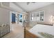 Guest bedroom with a workspace and access to other rooms at 1320 Appian Dr, Punta Gorda, FL 33950