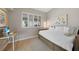 Charming bedroom with daybed, offering natural light and privacy at 1320 Appian Dr, Punta Gorda, FL 33950