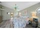 Spacious bedroom with king-size bed and en-suite bathroom access at 1320 Appian Dr, Punta Gorda, FL 33950