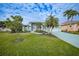 Single-story home with landscaped yard and a two-car garage at 1320 Appian Dr, Punta Gorda, FL 33950