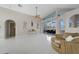 Spacious living room with water views and access to the lanai at 1320 Appian Dr, Punta Gorda, FL 33950