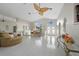 Open concept living room and dining area with tile flooring at 1320 Appian Dr, Punta Gorda, FL 33950