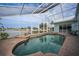 Inviting screened pool with brick pavers and water view at 1320 Appian Dr, Punta Gorda, FL 33950