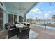 Relaxing screened-in pool and patio area with water view at 1320 Appian Dr, Punta Gorda, FL 33950