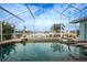 Relaxing screened-in pool and spa overlooking the canal at 1320 Appian Dr, Punta Gorda, FL 33950