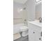 Bathroom featuring a toilet, tub, and white vanity at 13366 Bronze Ave, Port Charlotte, FL 33981