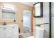 Main bathroom with vanity, shower, and updated finishes at 13366 Bronze Ave, Port Charlotte, FL 33981