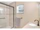 Bathroom features a vanity, shower, and window at 13366 Bronze Ave, Port Charlotte, FL 33981