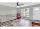 Living room with hardwood floors, ceiling fan, and comfortable seating at 13366 Bronze Ave, Port Charlotte, FL 33981