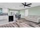 Bright living room with hardwood floors and access to kitchen at 13366 Bronze Ave, Port Charlotte, FL 33981