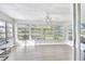Spacious sunroom featuring large windows and vinyl plank flooring at 13366 Bronze Ave, Port Charlotte, FL 33981