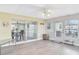 Bright sunroom with multiple windows and vinyl plank flooring at 13366 Bronze Ave, Port Charlotte, FL 33981