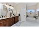 Elegant bathroom featuring double vanity and soaking tub at 15105 Aldama Cir, Port Charlotte, FL 33981