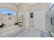 Bathroom with soaking tub, walk-in shower, and hexagon tile floor at 15105 Aldama Cir, Port Charlotte, FL 33981