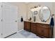 Bathroom with double vanity and hexagon tile floors at 15105 Aldama Cir, Port Charlotte, FL 33981