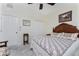 Spacious bedroom with double doors and ceiling fan at 15105 Aldama Cir, Port Charlotte, FL 33981