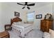 Cozy bedroom with a wooden bed frame and antique dresser at 15105 Aldama Cir, Port Charlotte, FL 33981