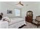 Charming bedroom with ceiling fan and antique furniture at 15105 Aldama Cir, Port Charlotte, FL 33981