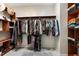 Large walk-in closet with shelving and hanging rods at 15105 Aldama Cir, Port Charlotte, FL 33981