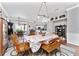 Spacious dining area with hardwood floors and view of kitchen at 15105 Aldama Cir, Port Charlotte, FL 33981
