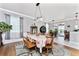 Bright dining room with hardwood floors and floral tablecloth at 15105 Aldama Cir, Port Charlotte, FL 33981