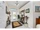 Bright entryway with tiled floor, coat rack, and decorative elements at 15105 Aldama Cir, Port Charlotte, FL 33981