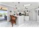 Eat-in kitchen with breakfast bar and view of backyard at 15105 Aldama Cir, Port Charlotte, FL 33981