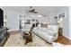 Relaxing living room with light leather furniture, hardwood floors, and large windows at 15105 Aldama Cir, Port Charlotte, FL 33981